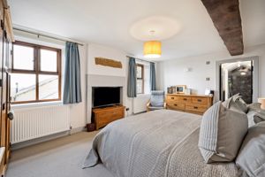 Principal bedroom with walk-in wardrobe and en-suite shower room- click for photo gallery